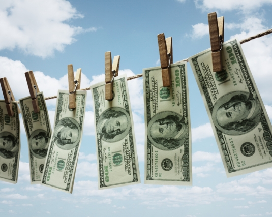 Money hanging from an outdoor clothesline