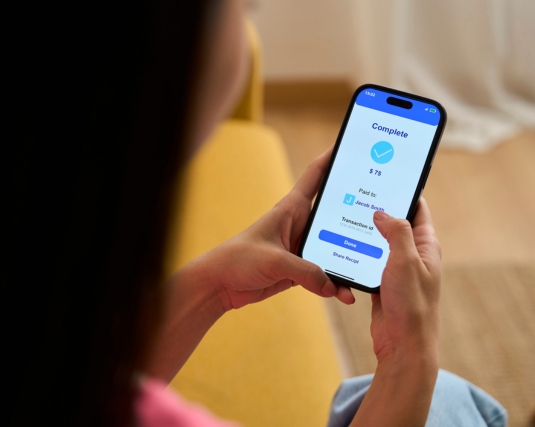 Person sending money on a peer-to-peer payment app.