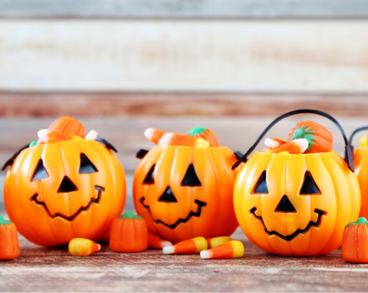 orange trick or treat jack o lanterns filled with candy corn