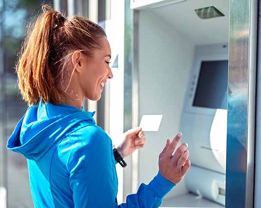 Young woman using an ATM