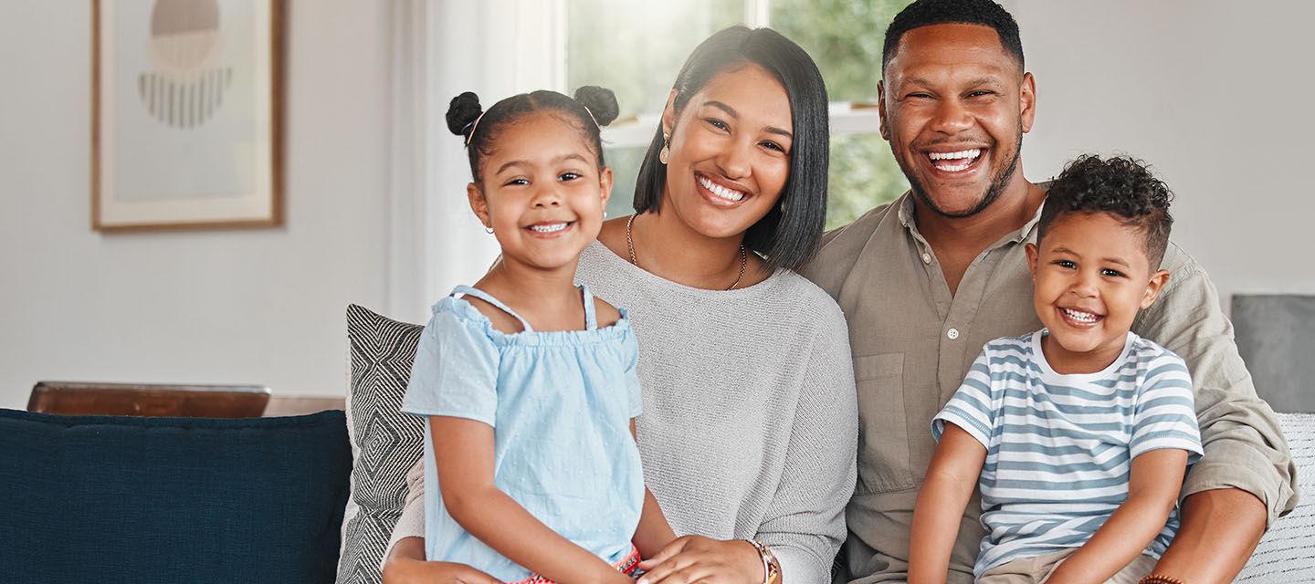 African-American family sitting on a couch