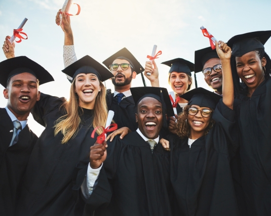 Shot of a group of cheerful university students on graduation day