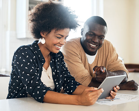 Couple working on an iPad