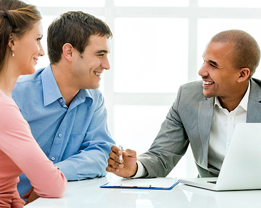 Couple speaking with a representative