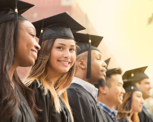 A group of college students attending their graduation.
