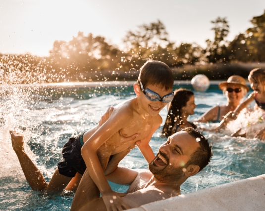 Family splashing in the pool