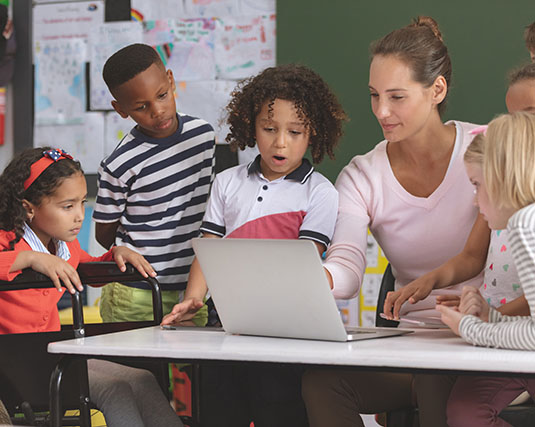 Teacher with young students