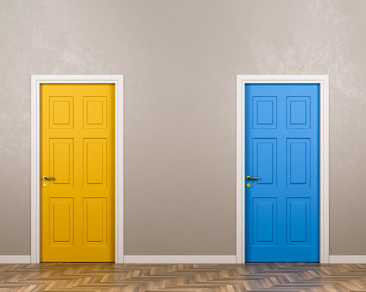 A yellow door and blue door on a tan wall