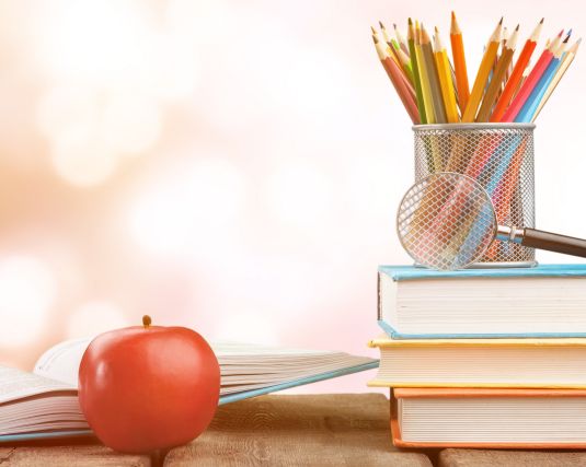 School Supplies with a red apple and pencils